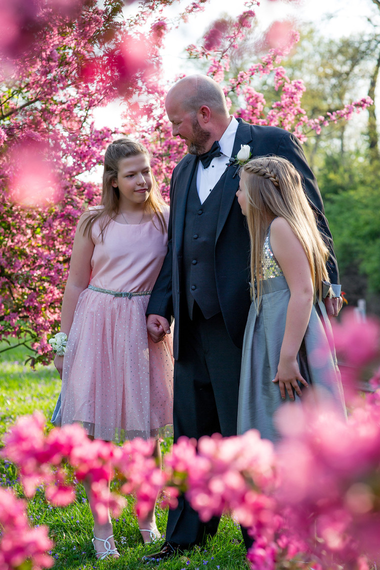 Sisters Maren and Zoe dance with their father, 42-year-old Charlie Kwentus, who has a brain tumor and recently stopped all treatment.