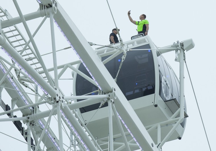 Nik Wallenda takes a selfie at the top of the Orlando Eye after his record breaking walk.