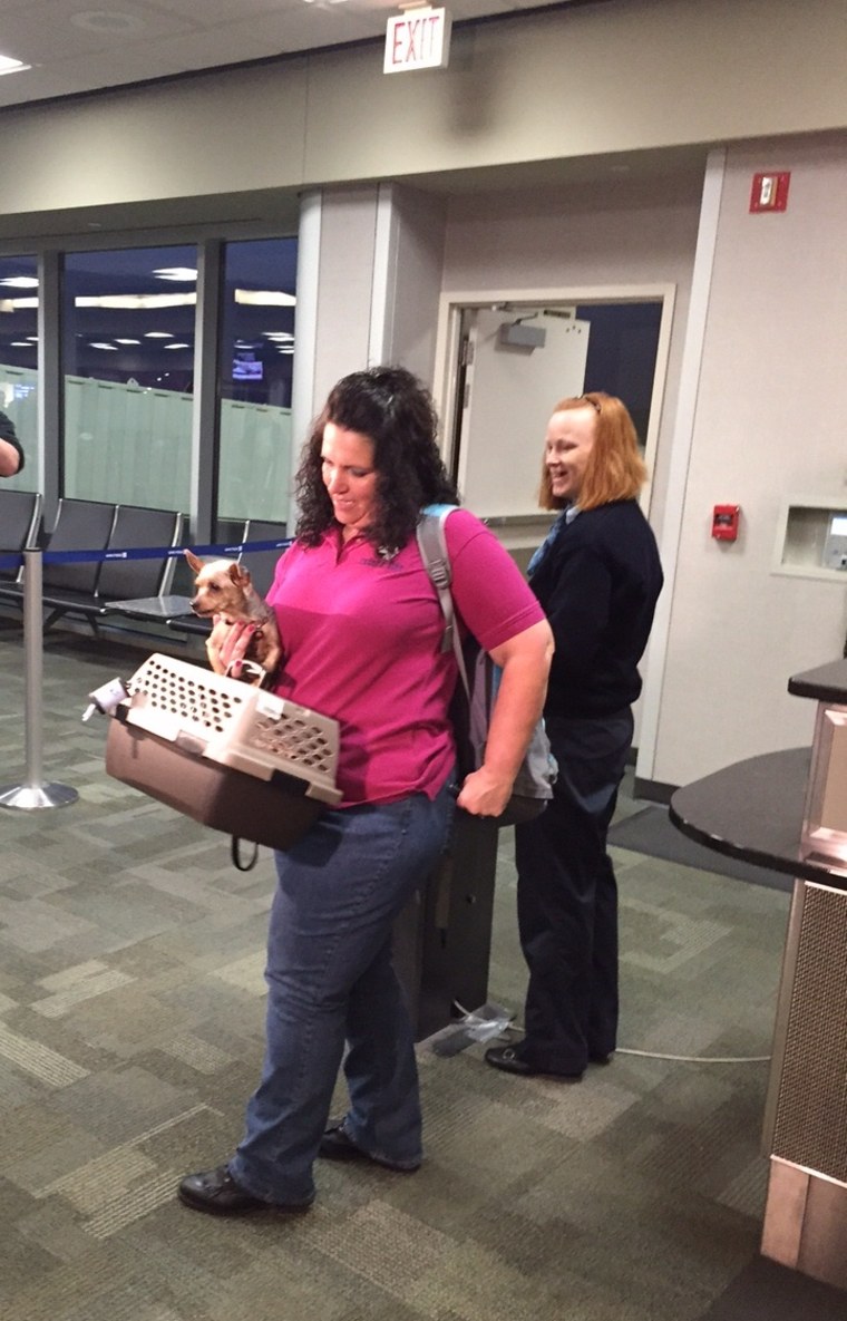 Sam and a Cedar Rapids animal-control specialist Michelle Johnson flew Wednesday to New Orleans to reunite the dog with his family.