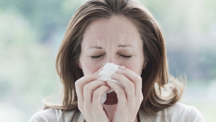 sneezing woman