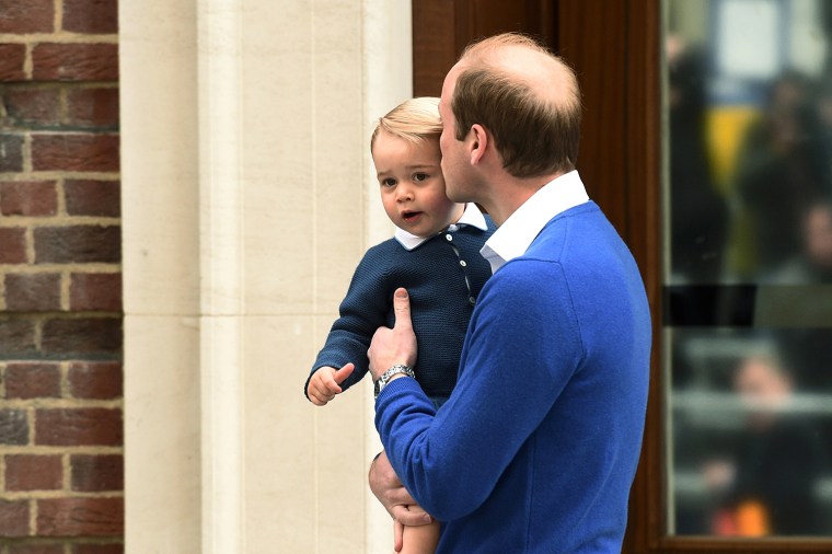 Prince William kisses Prince George outside the Lindo Wing