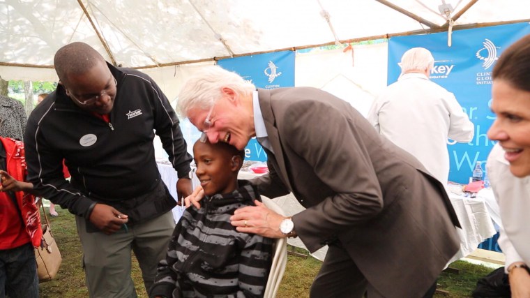 Former President Bill Clinton tours projects in Africa.