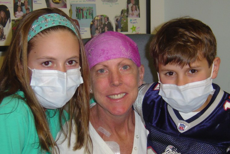 Kathy's two children, Nicole and David, visiting Kathy in the hospital during one of her treatments.