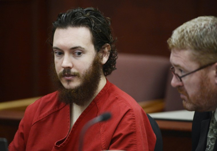 Image: File photo of Holmes and his defense attorney King sit in court for an advisement hearing at the Arapahoe County Justice Center in Centennial