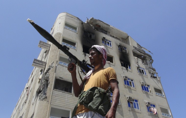 Image: A Southern Popular Resistance fighter secures a street during fighting against Houthi fighters in the Dar Saad district of Yemen's southern port city of Aden
