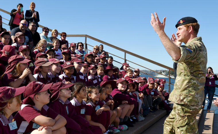 Britain's Prince Harry speaks to children from St Mary's South Public School during a visit to Sydney's Opera House