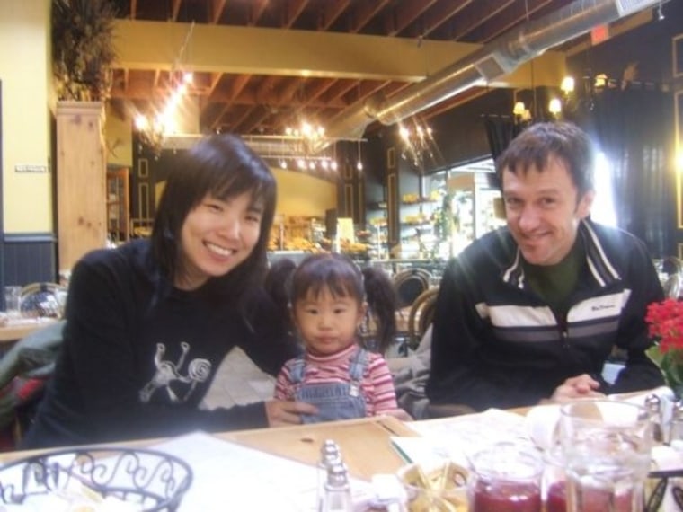 Sandra Kim, Willem van der Hoeven and their daughter Adriana. Sandra kept a super-detailed baby book for Adriana because she didn't want to forget a single moment.