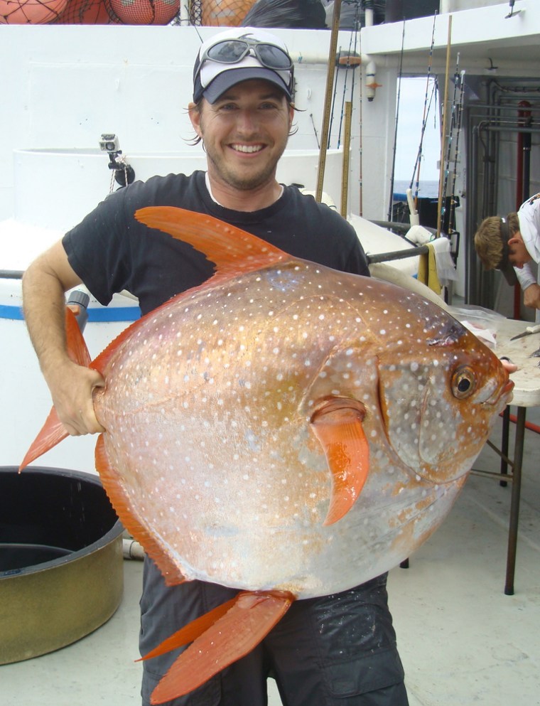 Image: Biologist Nick Wegner holds a captured opah