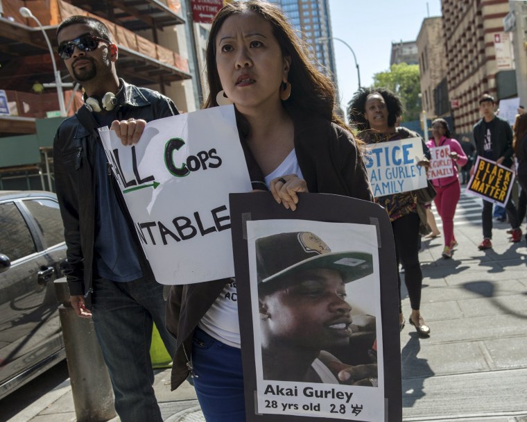 Image: Demonstrators protest outside the Brooklyn Supreme Courthouse in the Brooklyn borough of New York