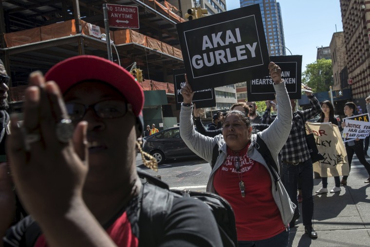 Image: Demonstrators protest outside the Brooklyn Supreme Courthouse in Brooklyn borough of New York