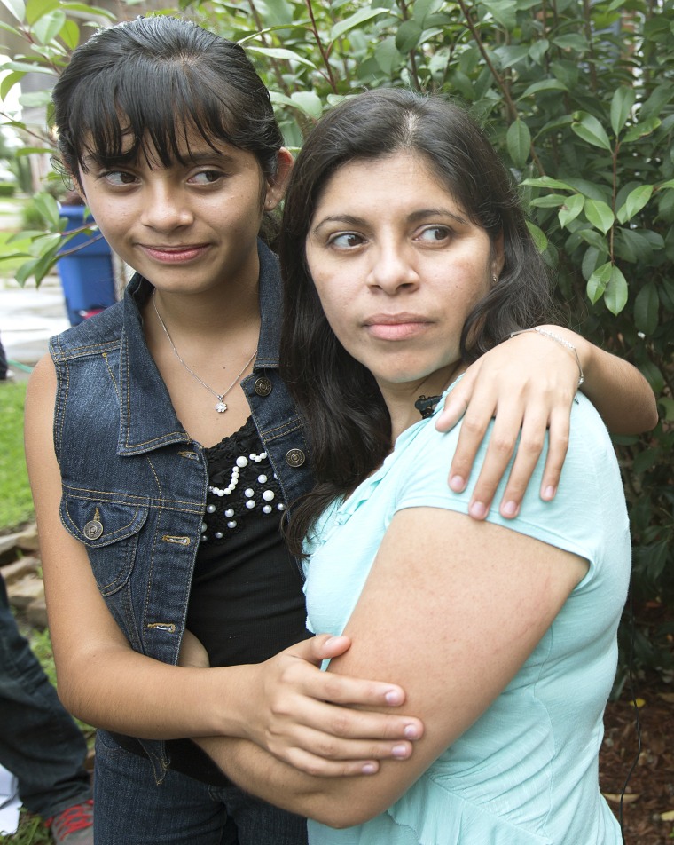 Image: Alondra Diaz, 13, and her mother, Dorotea Garcia, right, embrace after after Diaz was returned to the United States.
