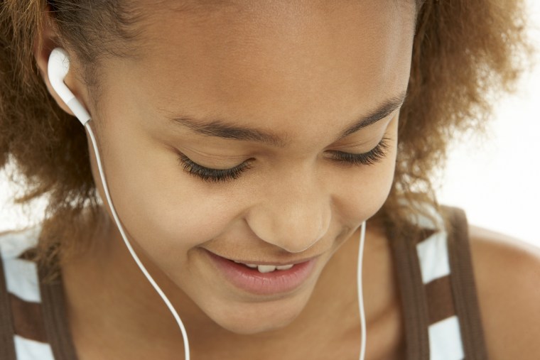 Teenage Girl Listening To MP3 Player