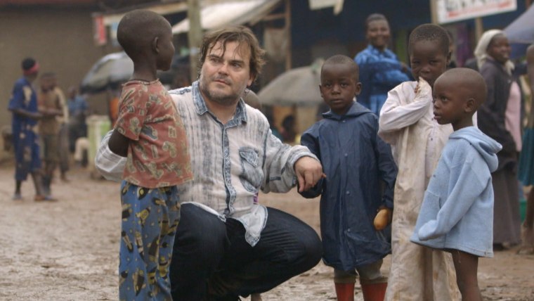 Jack Black speaks to children in a slum in Uganda to raise awareness of kids living in poverty as part of Red Nose Day