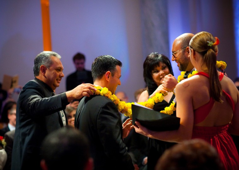 Image: Ruben Gonzales and his husband Joaquin Tamayo have a lasso placed over them during their wedding on Nov. 5, 2011.