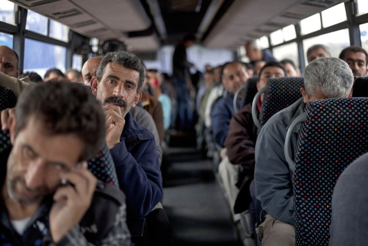 Image: Palestinian laborers on bus in 2013