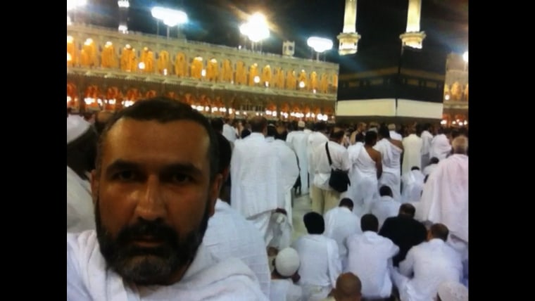 Sharma takes a selfie with his iPhone at the Kaaba, where filming is forbidden.