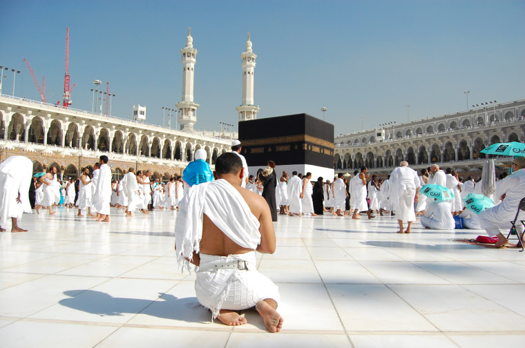 A pilgrim deep in prayer at the Kaaba.