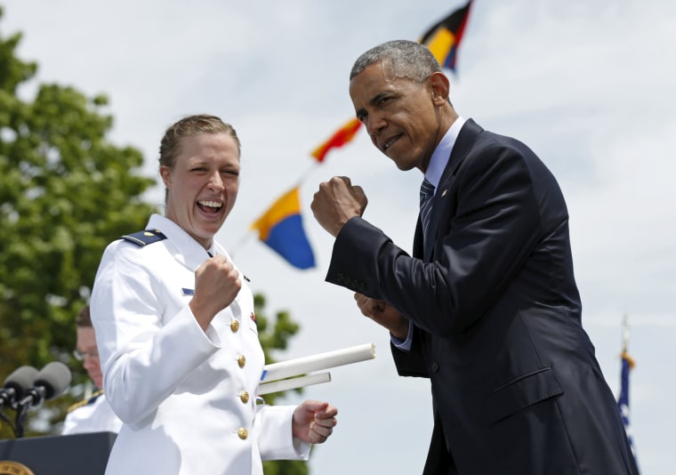 Image: U.S. President Obama and a graduate put up their fists during the 134th Commencement Exercises of the United States Coast Guard Academy in New London, Connecticut