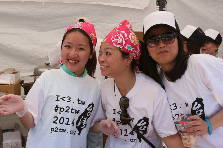 Volunteers pause for a photo while taking a break serving up Taiwanese food to thousands of hungry attendees at the 2014 Passport to Taiwan event. 