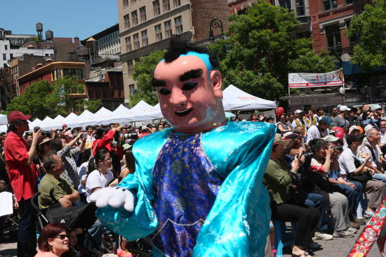 A member of the Taiwanese American Association of New York Santaizi dance troupe dons the costume of a Chinese god and entertains the audience at the 2014 Passport to Taiwan.