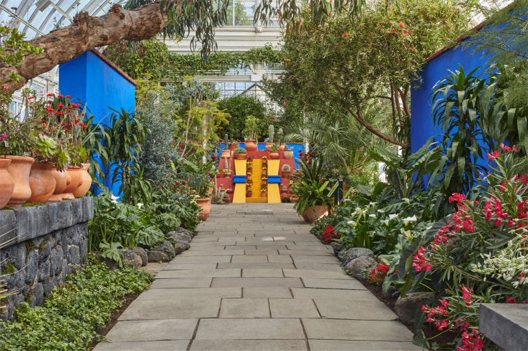 Image: An homage to the signature blue walls of the Casa Azul leads visitors through a landscape of Mexican plants.