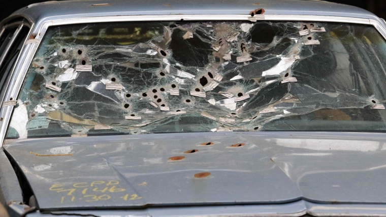 Image: Timmothy Russell's windshield is shown during a mock up of the crime scene during manslaughter trial for a police officer in Cleveland