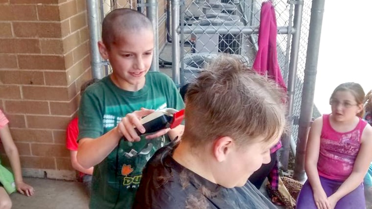 Teacher shaves head to support student