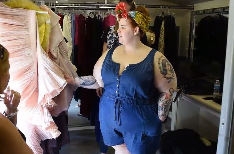 Tess Holliday backstage looking at outfits
