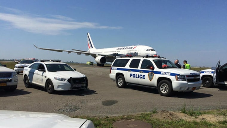 An Air France Flight was screened at JFK airport because of reports of a chemical threat on board, a source told NBC News.