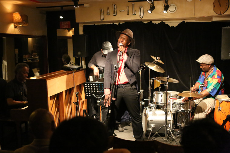 Christian Lauretta belts out classic and contemporary jazz tunes in Creole and French. Performing here with the George-Edouard Nouel Trio are pianist Nouel, bassist St. Aime Prosper and drummer Serge Marne.