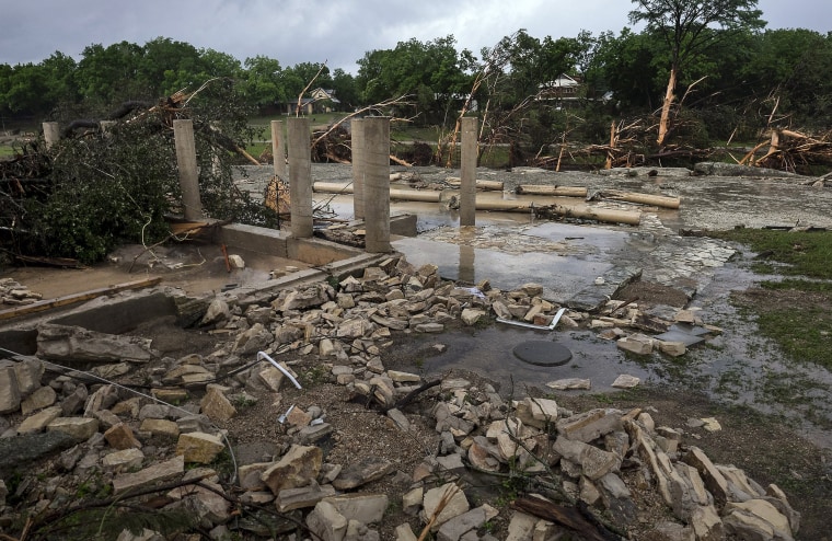 Image: The cement stilts of the home belonging to the Carey family of Corpus Christi, Texas, are all that remain the home was swept away by the Blanco River early  Sunday morning during a flash flood in Wimberley, Texas
