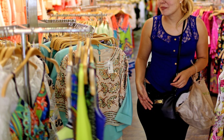 A shopper looks for clothes in a Miami store.  