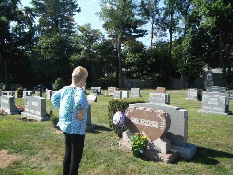 Barbara Thomas stands at her daughter Lisa's grave. Lisa was found murdered on October 8th, 1974. 