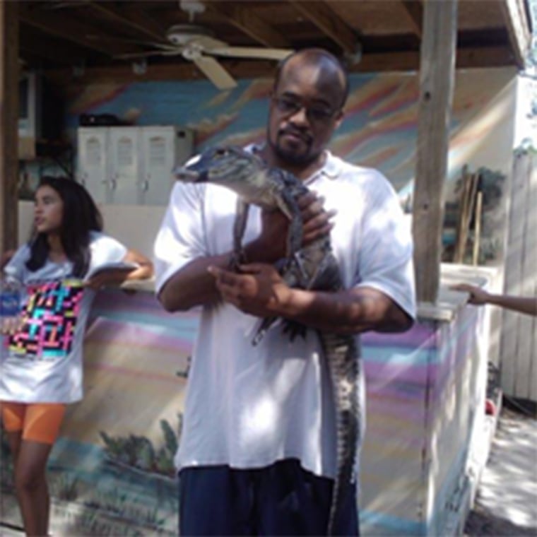 Image: Jermaine McBean with an alligator