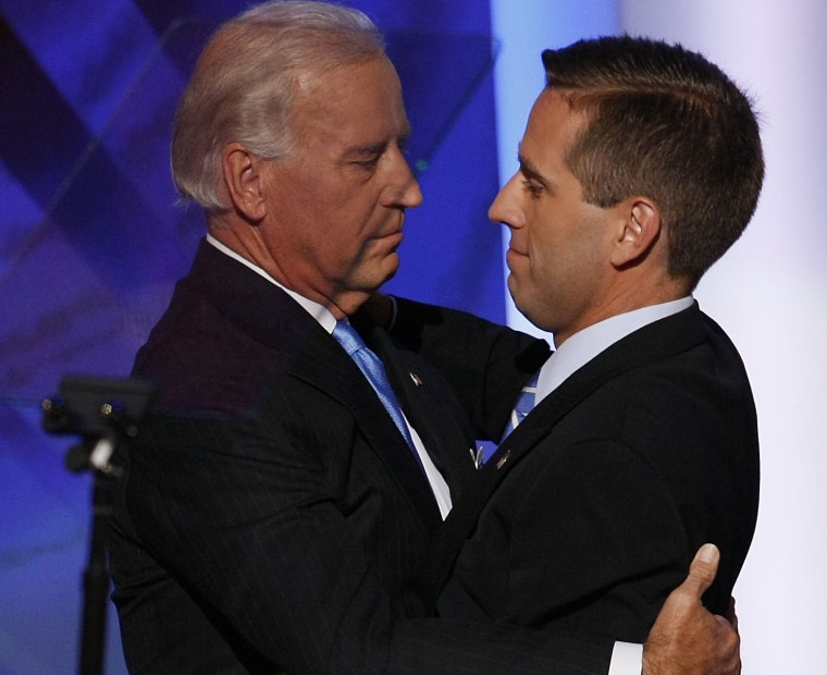 Then-U.S. Democratic Vice-Presidential nominee Sen. Joe Biden (L) hugs his son Delaware Attorney General Beau Biden, during day three of the Democratic National Convention (DNC) at the Pepsi Center August 27, 2008 in Denver, Colorado. 