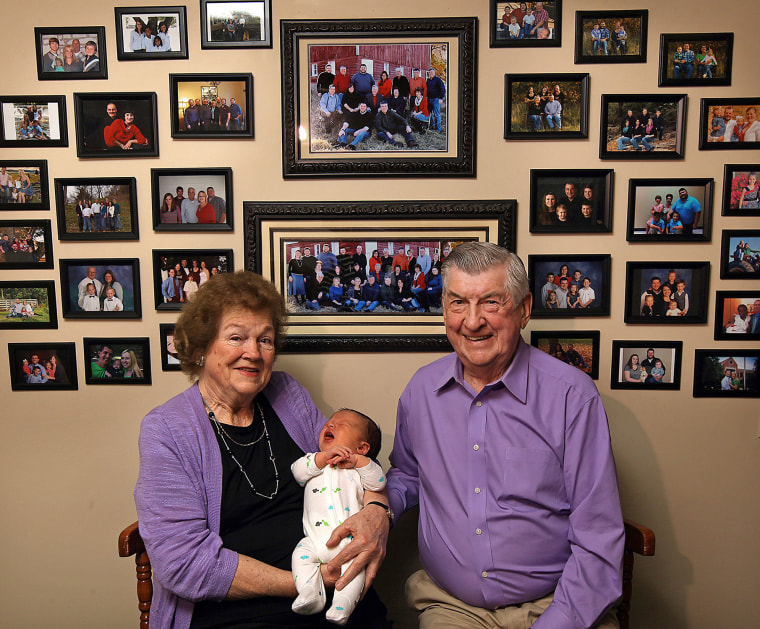 Leo and Ruth Zanger sit with their 100th grandchild