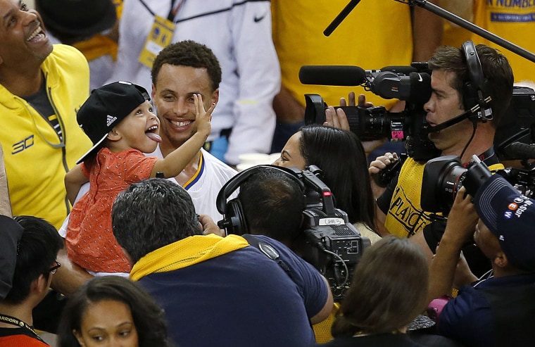 Stephen Curry and his daughter after the Golden State Warriors win