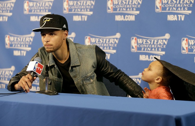 Stephen Curry and his daughter at the press conference following the Golden State Warriors win