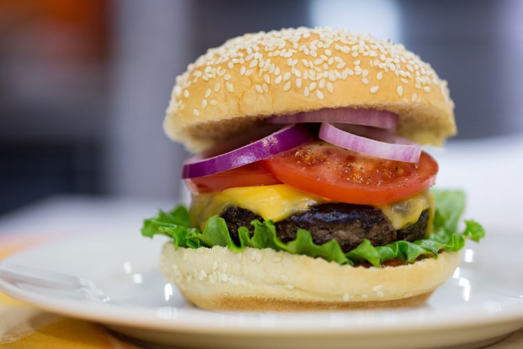 Justin Chapple cooks burgers for National Burger Day