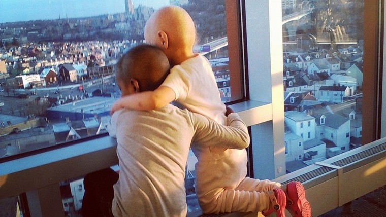 This photo of Madelina DeLuca and Maliyah Jones, embracing while fighting cancer at Children’s Hospital of Pittsburgh, has gone viral online.