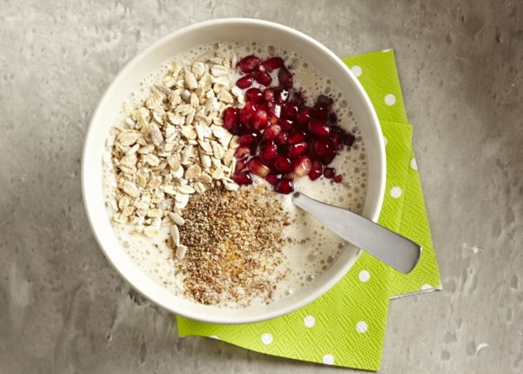 Banana and coconut smoothie bowl with chia, muesli and pomegranate seeds