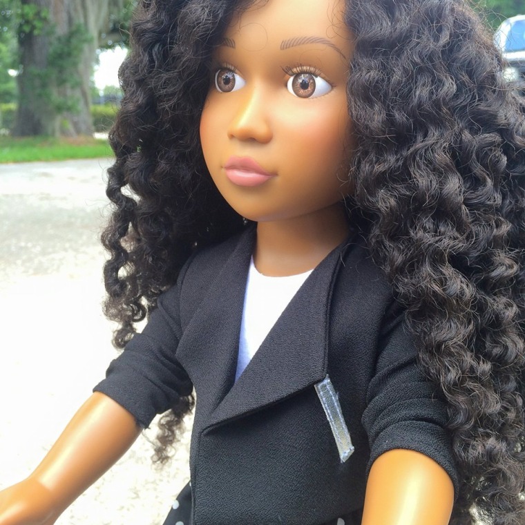 The 18-inch doll has washable, natural kinky hair.