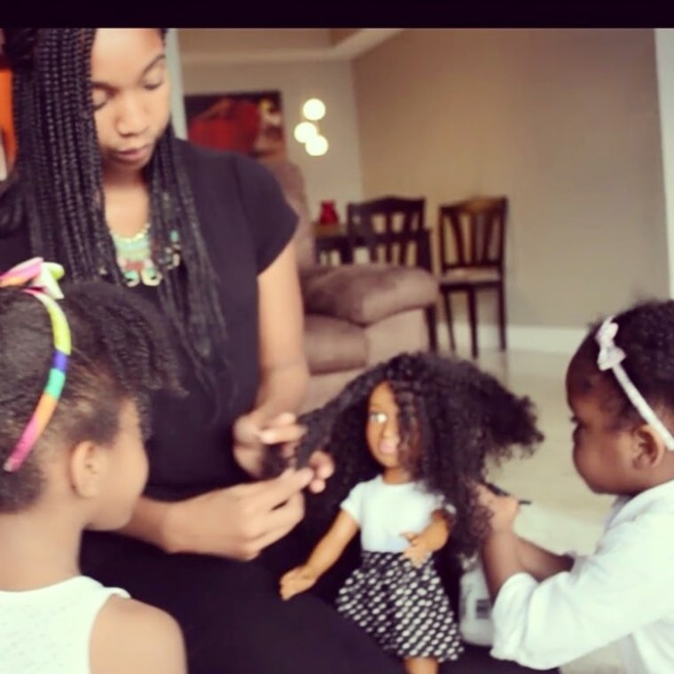 Sophia, 4, and sister Sydney, 2, love playing with their doll's hair.