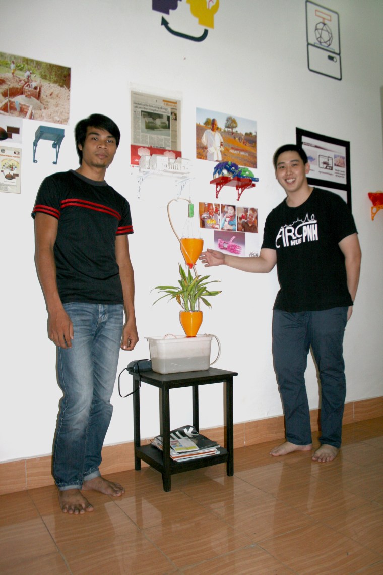 Horn Him, left, and KiHow Tran pose in the ARC Hub PNH office.