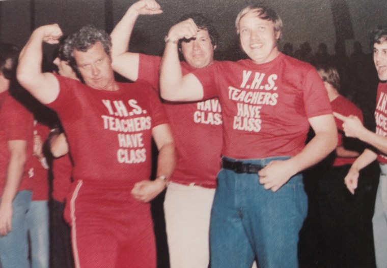 Dennis Hastert poses with wrestlers in a yearbook photo.