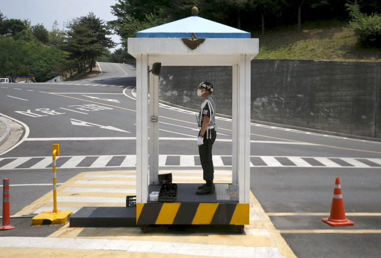 Image: A military policeman wearing a mask as a precaution against contracting MERS