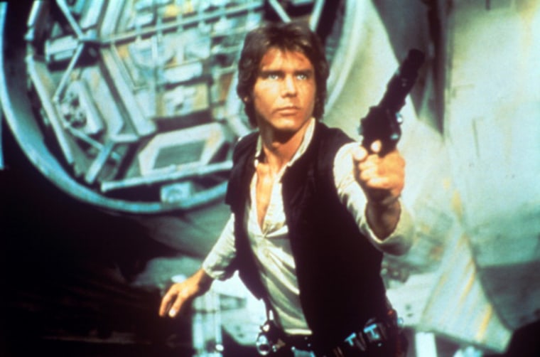 Harrison Ford drawing a gun