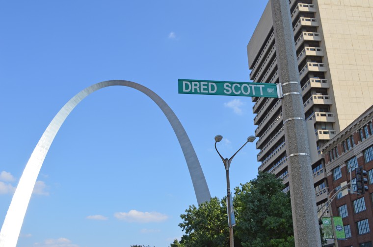 “Dred Scott Way” street sign hangs in front of the St. Louis Arch.