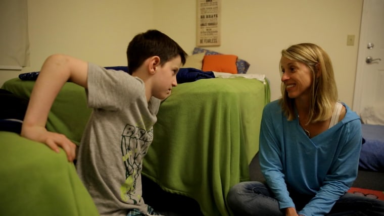 Brady and his mother Kristin inside Brady's room at Camp Sundown in upstate New York.