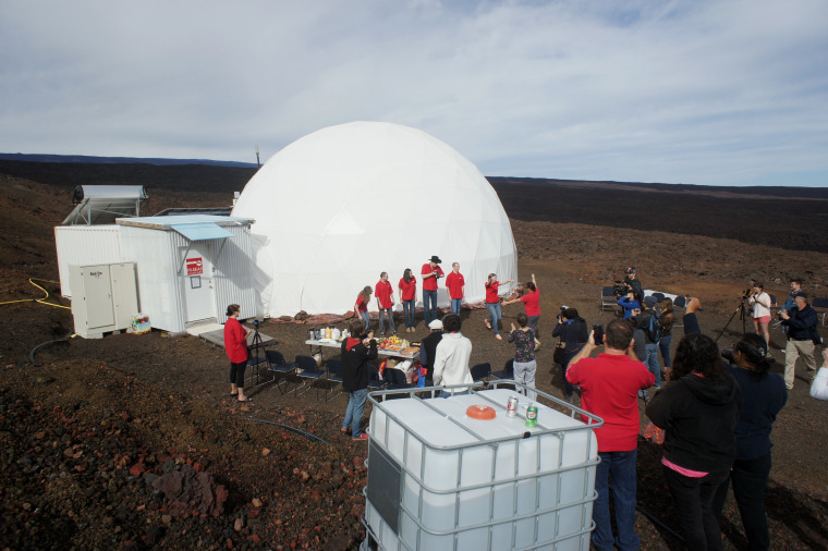 Six scientists exit a dome that they lived in as part of an isolated existence to simulate life on a mission to Mars on the Big Island of Hawaii, Saturday, June 13, 2015.